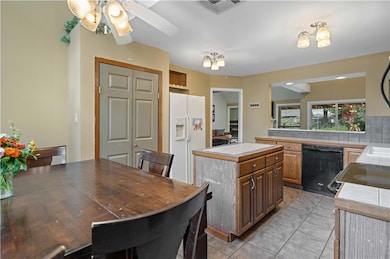 The dining and kitchen areas flow/open up to the l