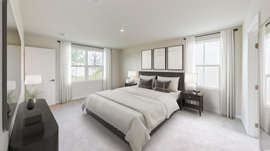 Bedroom with light carpet and recessed lighting
