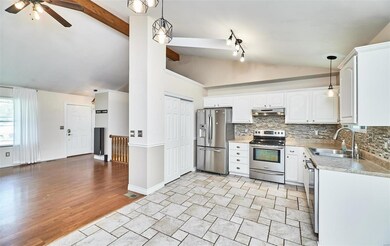 Open floor plan to the kitchen. SS appliances and 