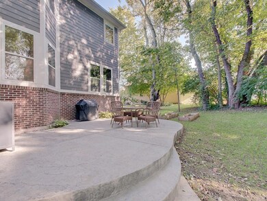 Second tier stamped concrete patio offers a fantastic area for summer cookouts