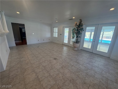 Unfurnished living room with french doors, visible
