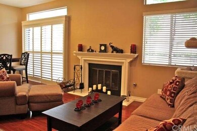 Elegant living and dining room with wood style flo