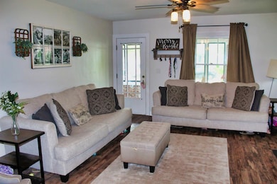 Warm and inviting Living Room features vinyl plank