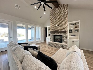 Living room with light hardwood / wood-style floor