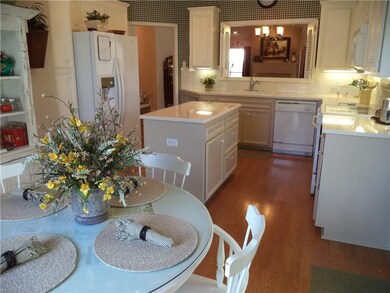 Kitchen with breakfast area, island, quartz counte