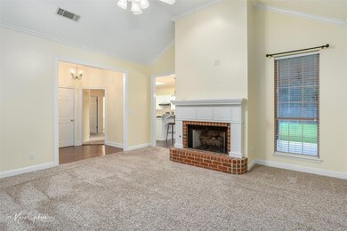 Living room featuring a fireplace, high vaulted ce
