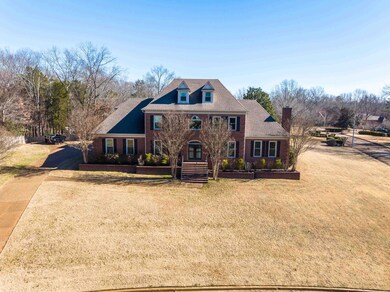 Colonial inspired home featuring a front lawn