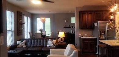 Living room featuring a chandelier and a ceiling 