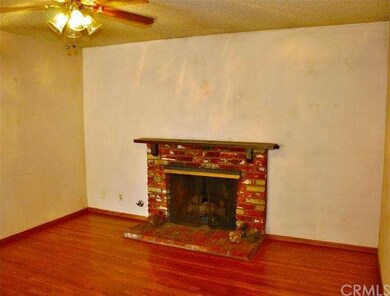 The livingroom features refinished hardwood floors