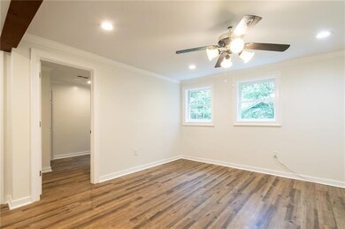 Empty room featuring ornamental molding, wood finished floors, recessed lighting, and ceiling fan