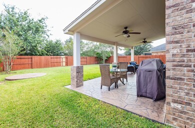 HUGE covered patio with ceiling fans, stamped concrete flooring, and room for outdoor dining AND outdoor living space. Watch the kids or pets run around while you sip on a glass of wine or enjoy your morning coffee.