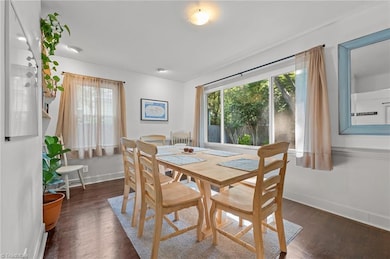 Dining room with backyard views.