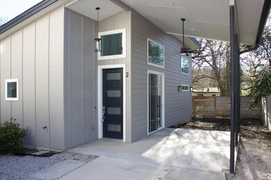 Rear view of property featuring fence and a patio
