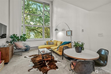 Expansive windows bring city + greenery views.