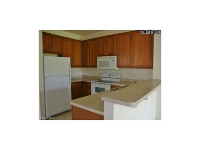 Plenty of counter space and oak cabinets in the ki