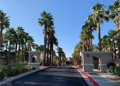 View of asphalt street featuring curbs