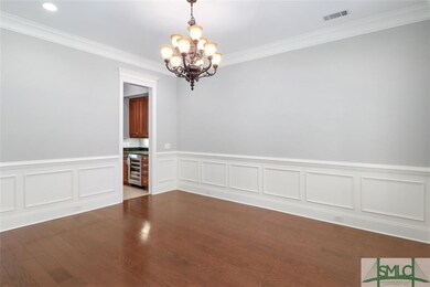 Large dining room with butlers pantry between kitc