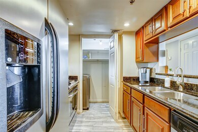 This galley kitchen offers elegant granite counter