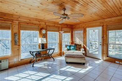 Sun room leads to rear deck.