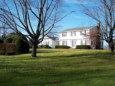Exterior Front. House sets above and...