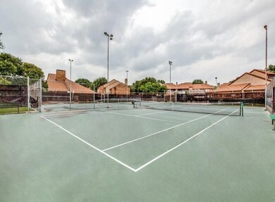 View of sport court featuring fence