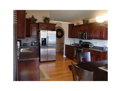Kitchen. Cabernet stained cherry cabinetry with cr