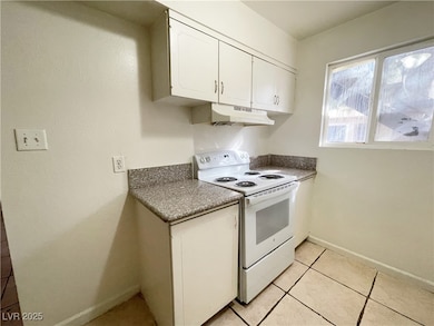 Kitchen with under cabinet range hood, white cabin