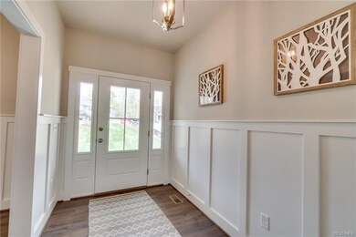 Foyer has Craftsman Style Wainscoting