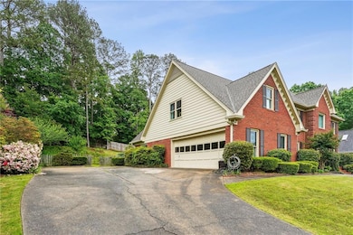 View of front facade with brick siding, asphalt dr