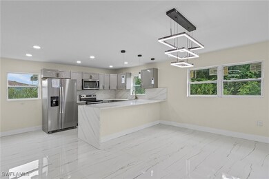 Kitchen featuring appliances with stainless steel