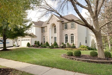 Beautiful, manicured landscaping surrounds this ho