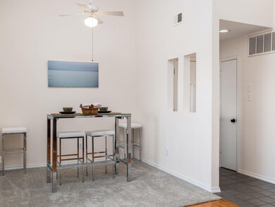 Dining area featuring a ceiling fan, baseboards, 