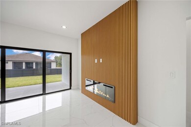 Unfurnished living room with marble tiled flooring