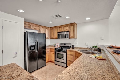 Kitchen featuring appliances with stainless steel
