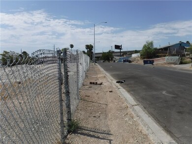 View of asphalt road featuring curbs