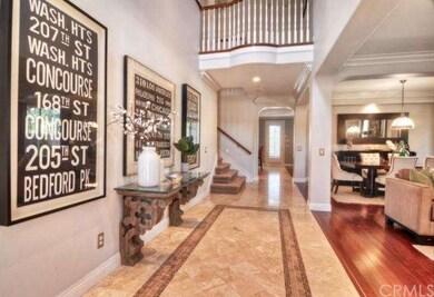 Dramatic 2-story entry with stone flooring and ope
