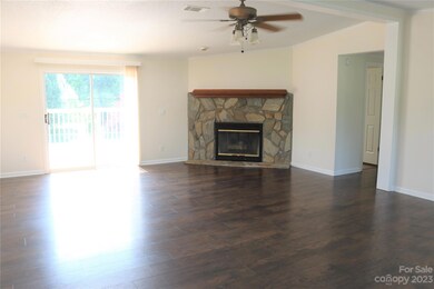 Living Room with Wood Burning Fireplace.