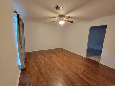 Living Room with laminate wood floors and entrance