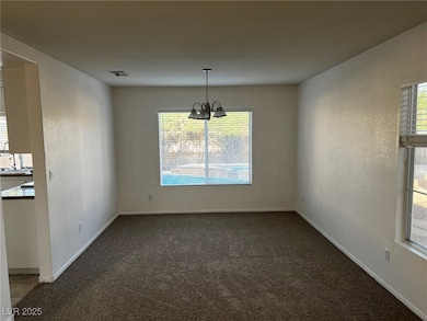 Unfurnished dining area featuring visible vents, b