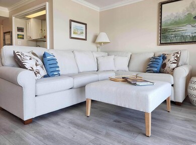 Living area featuring wood finished floors and orn
