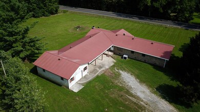 An aerial view of the home and property shows space for outdoor fun or gardening.