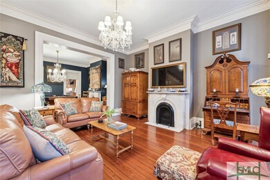 Front parlor with original fireplace and mantle
