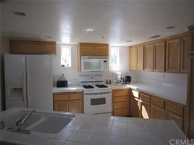 Kitchen with gas cooking, microwave, dual door ref
