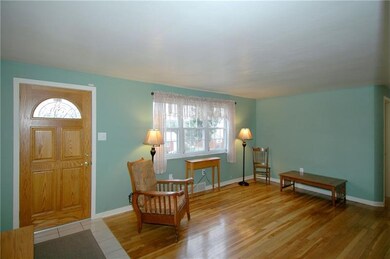 Ceramic floor entry and hardwood floor in the livi