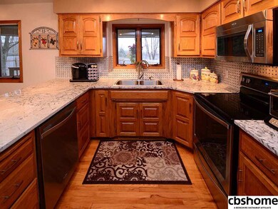 Granite countertop, tile backsplash, hardwood floors, new stainless steel appliances.