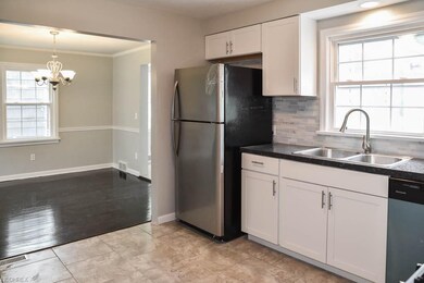 The kitchen opens to the dining room.