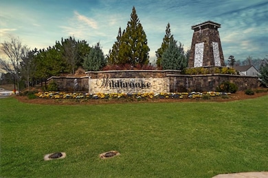 Community sign featuring a lawn