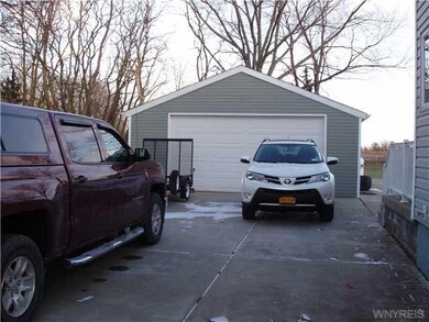 Exterior Front. Three car garage, insulated and he