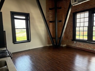 Steel Beams, exposed brick wall & vintage windows