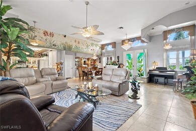 Tiled living room featuring ceiling fan with Swaro